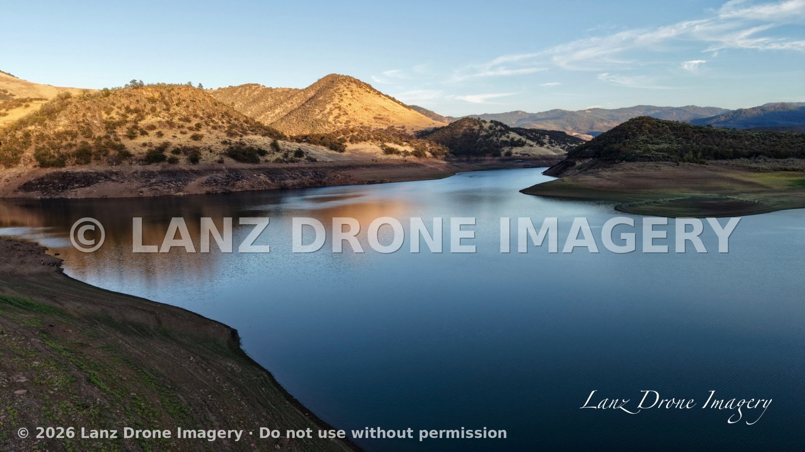 Aerial view of Emigrant Lake near Ashland, Oregon, winding between golden hills