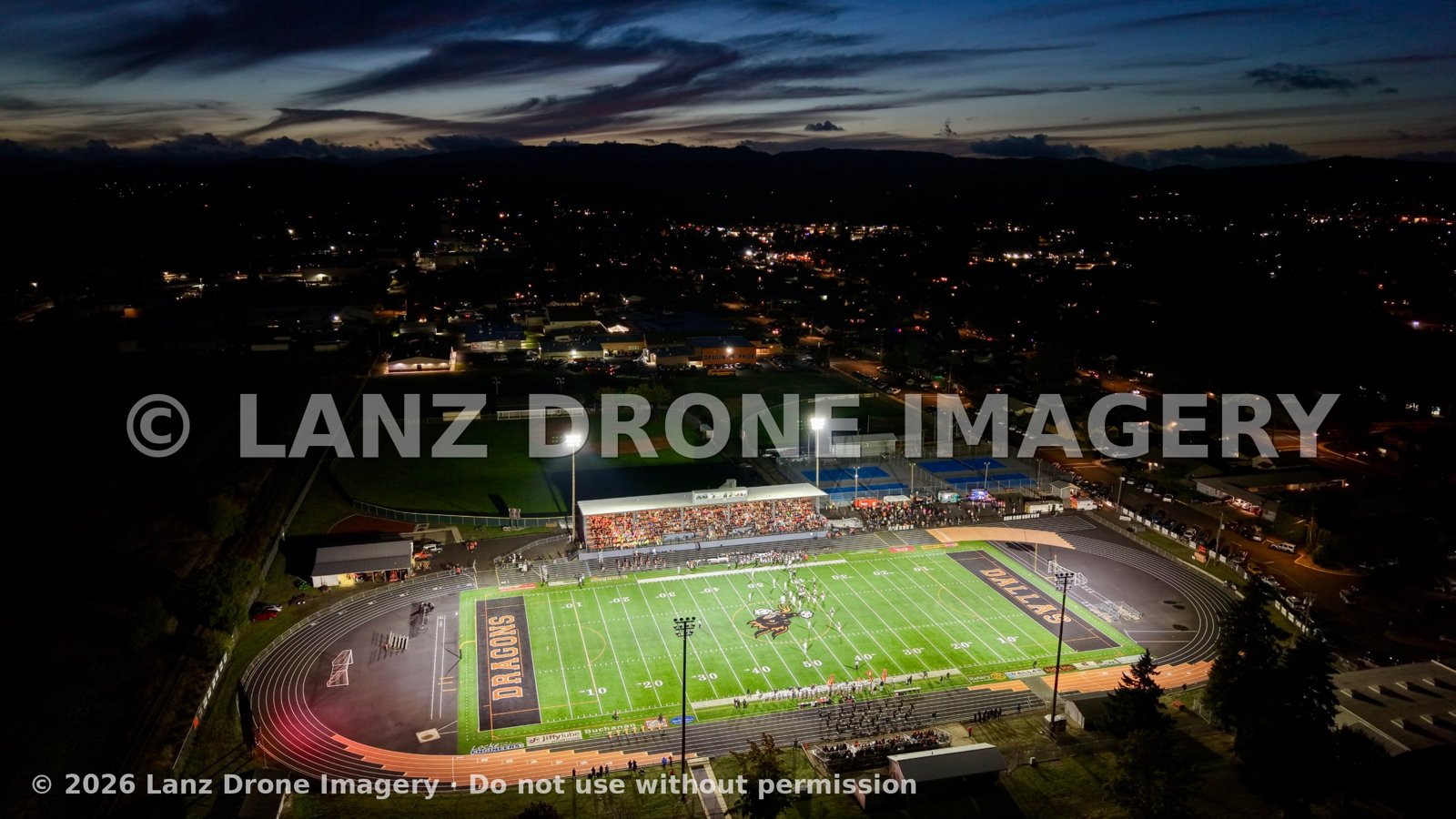 Aerial view of the Dallas Dragons stadium lit up during a night football game